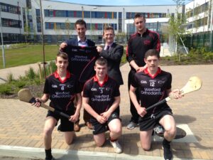 Don Ryan presents a set of jerseys to the first ever senior GAA team from Creagh College, Gorey.